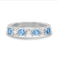 Half set ring with 0.70 carat blue and white lab grown diamonds in white gold