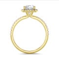 1.50 carat solitaire halo ring with a lab grown cushion diamond in yellow gold with round lab grown diamonds