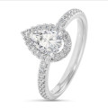 1.20 carat solitaire halo ring with lab grown pear diamond in white gold with round lab grown diamonds