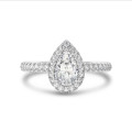 1.20 carat solitaire halo ring with lab grown pear diamond in white gold with round lab grown diamonds
