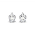 4.00 carat solitaire lab grown pear cut diamond earrings in white gold