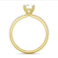 3.00 carat solitaire ring with a lab grown emerald cut diamond in yellow gold with lab grown side diamonds