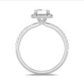 2.00 carat solitaire halo ring with a lab grown emerald cut diamond in white gold with round lab grown diamonds