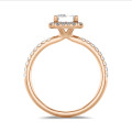 2.00 carat solitaire halo ring with a lab grown emerald cut diamond in red gold with round lab grown diamonds