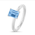 2.00 carat solitaire ring with a blue lab grown emerald cut diamond in white gold