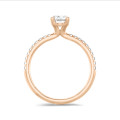 1.00 carat solitaire ring with lab grown oval diamond in red gold with lab grown side diamonds