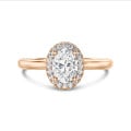 1.50 carat solitaire halo ring with lab grown oval diamond in red gold with round lab grown diamonds