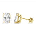 2.00 carat solitaire lab grown oval cut diamond earrings in yellow gold