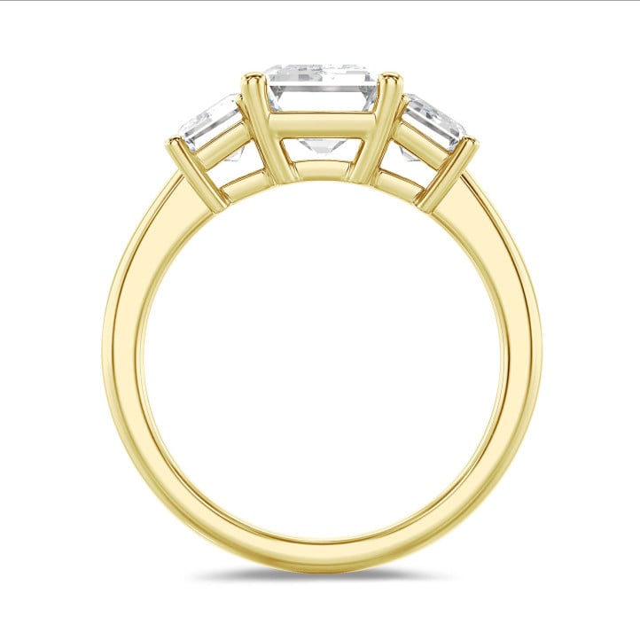 4.40 carat trilogy ring in yellow gold with lab grown emerald cut diamonds