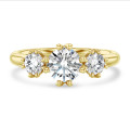 1.60 carat trilogy ring in yellow gold with round lab grown diamonds