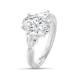 Trilogy ring with a 3.00 carat oval diamond with side pear diamonds of 0.35 carat each in platinum