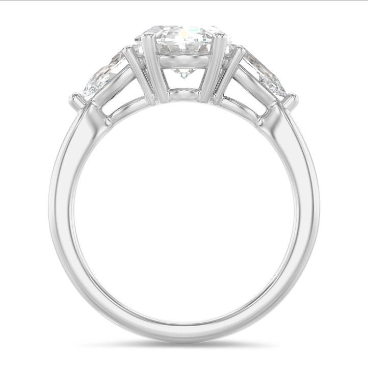 Trilogy ring with a 3.00 carat oval diamond with side pear diamonds of 0.35 carat each in white gold