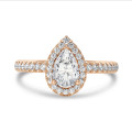 5.00 carat solitaire halo ring with lab grown pear diamond in red gold with round lab grown diamonds