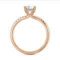 1.00 carat solitaire ring with a lab grown emerald cut diamond and hidden halo in red gold