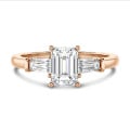 2.00 carat trilogy ring in red gold with a lab grown emerald cut diamond and lab gown tapered baguettes