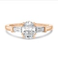 2.00 carat trilogy ring in red gold with lab grown oval diamond and lab grown tapered baguettes