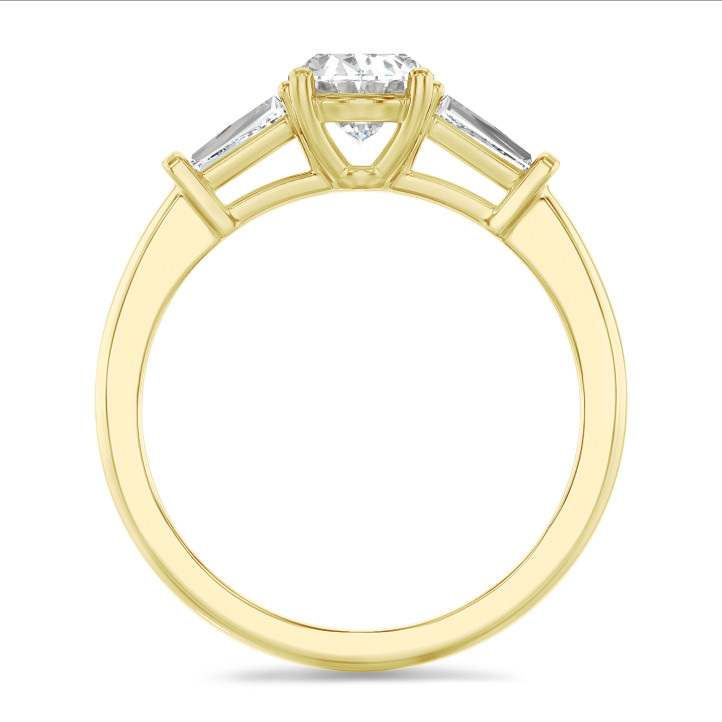 2.00 carat trilogy ring in yellow gold with lab grown oval diamond and lab grown tapered baguettes