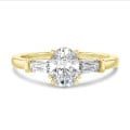2.00 carat trilogy ring in yellow gold with lab grown oval diamond and lab grown tapered baguettes