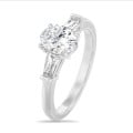 2.00 carat trilogy ring in platinum with lab grown oval diamond and lab grown tapered baguettes