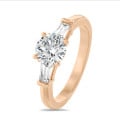 2.00 carat trilogy ring in red gold with round lab grown diamond and lab grown tapered baguettes