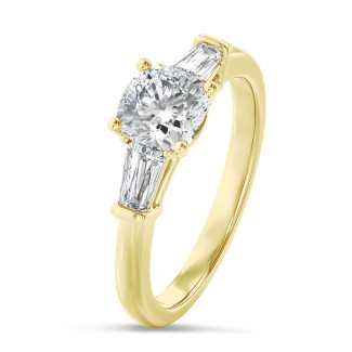 3.00 carat trilogy ring in yellow gold with a lab grown cushion diamond and lab grown tapered baguettes