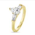 3.00 carat trilogy ring in yellow gold with lab grown pear diamond and lab grown tapered baguettes