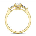 3.00 carat trilogy ring in yellow gold with lab grown pear diamond and lab grown tapered baguettes