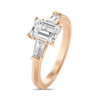 3.00 carat trilogy ring in red gold with a lab grown emerald cut diamond and lab gown tapered baguettes