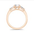 3.00 carat trilogy ring in red gold with round lab grown diamond and lab grown tapered baguettes