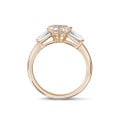 2.00 carat trilogy ring in red gold with lab grown marquise diamond and lab grown tapered baguettes