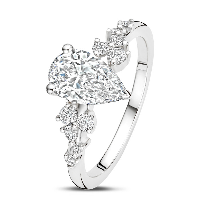 1.50 carat solitaire cluster ring in white gold with a pear cut diamond