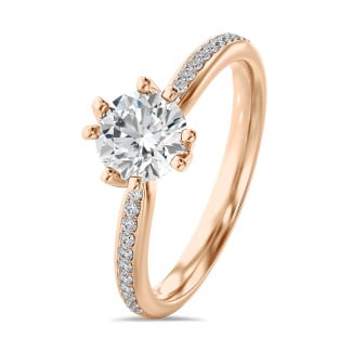 2.00カラットのソリティア・ダイヤモンドリング（レッドゴールド製）に人工ダイヤモンドをサイドにあしらったもの