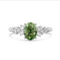 1,00 karaat solitair cluster ring in witgoud met Fancy Vivid Green ovale laboratoriumgekweekte diamant